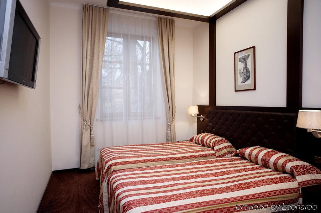 Amberton Cozy Hotel Kaunas Quarto foto